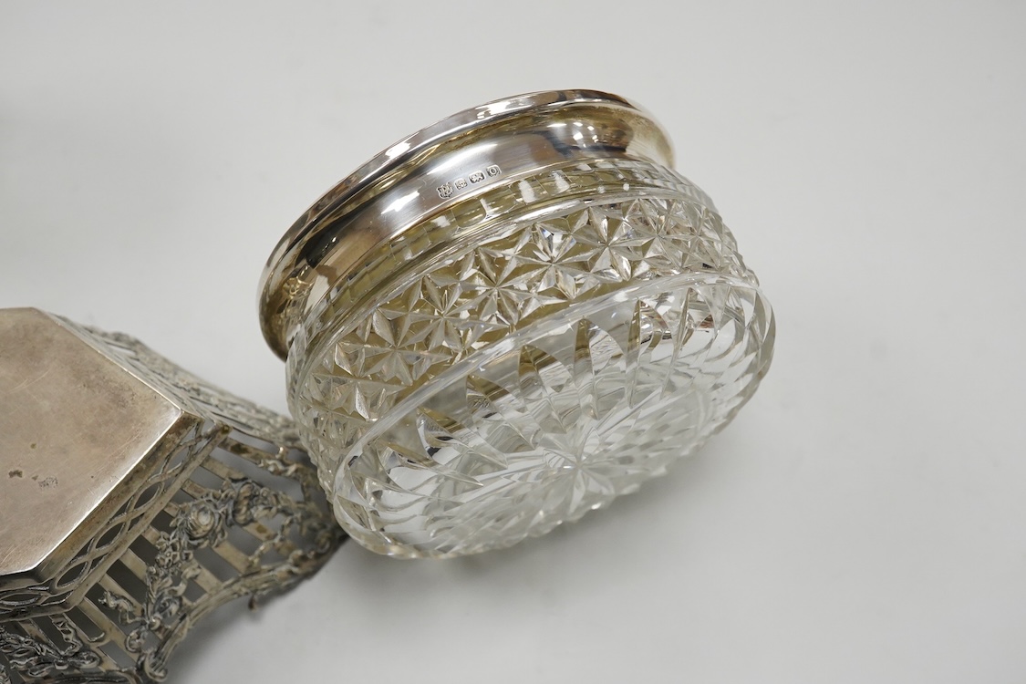 A German pierced 800 standard white metal bowl, 21.2cm, an engine turned white metal cigarette canister and a silver mounted glass dressing table pot.